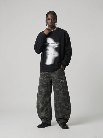 DAXUEN black oversized abstract ghostly graphic top — model photo