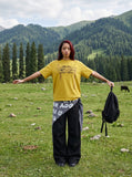 DAXUEN Abstract graphic loose-fit t-shirt in multiple colors — model photo