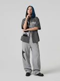 DAXUEN Oversized short-sleeved collared shirt with abstract graphics — model photo