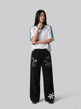 DAXUEN light grey marl wide-leg abstract graphic pants — model photo