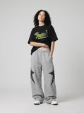 DAXUEN solid color oversized abstract motion graphic t-shirt — model photo