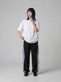 DAXUEN white oversized abstract mushroom graphic T-shirt — model photo