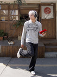 DAXUEN grey long-sleeved abstract musical graphic polo shirt — model photo