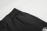 DAXUEN washed black wide-leg abstract-script sweatpants