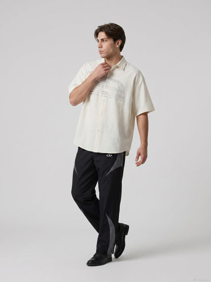 DAXUEN Oversized short-sleeved button-up shirt with graphic — model photo