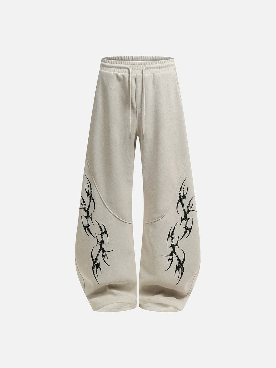 DAXUEN beige oversized abstract tribal graphic sweatpants