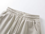 DAXUEN beige oversized abstract tribal graphic sweatpants