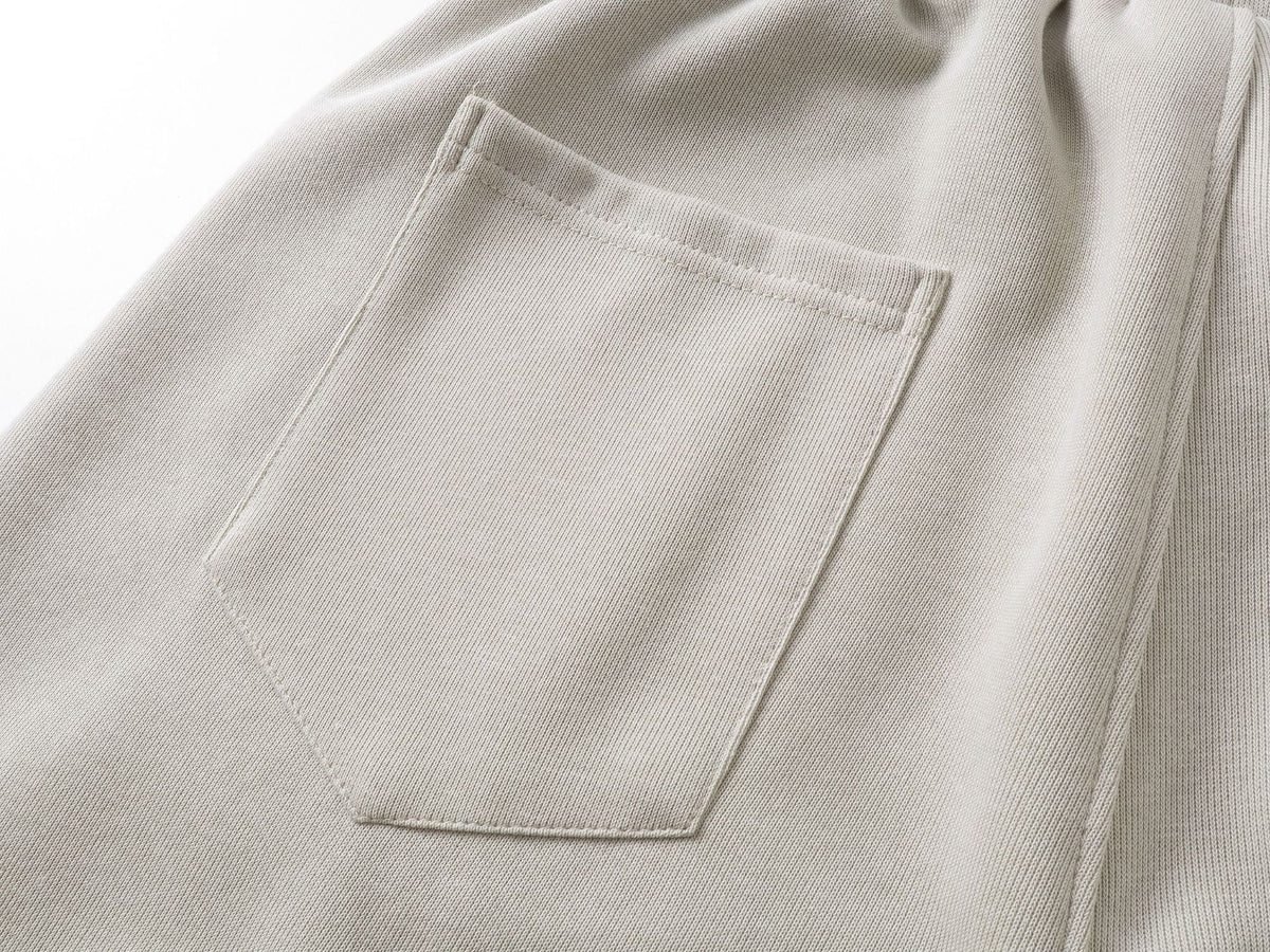 DAXUEN beige oversized abstract tribal graphic sweatpants