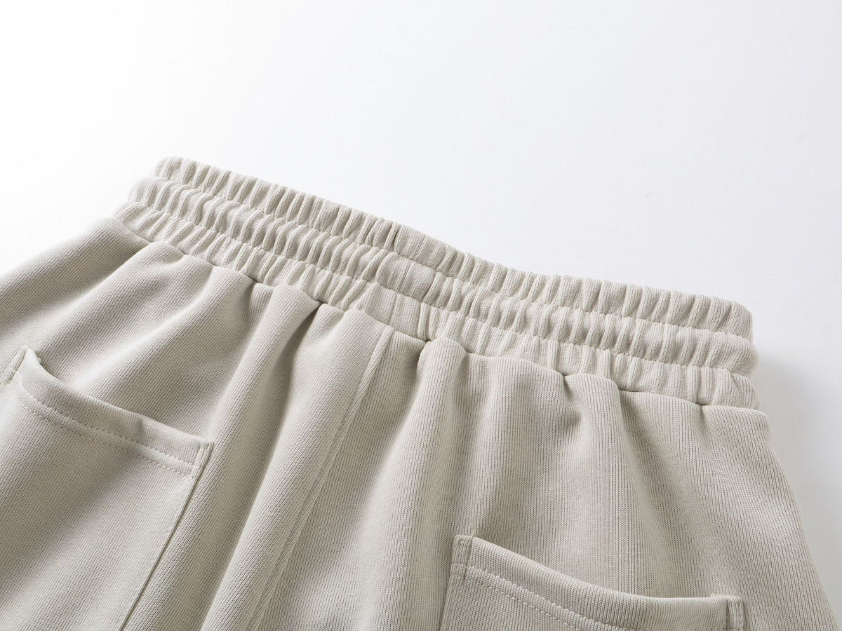 DAXUEN beige oversized abstract tribal graphic sweatpants