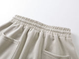 DAXUEN beige oversized abstract tribal graphic sweatpants