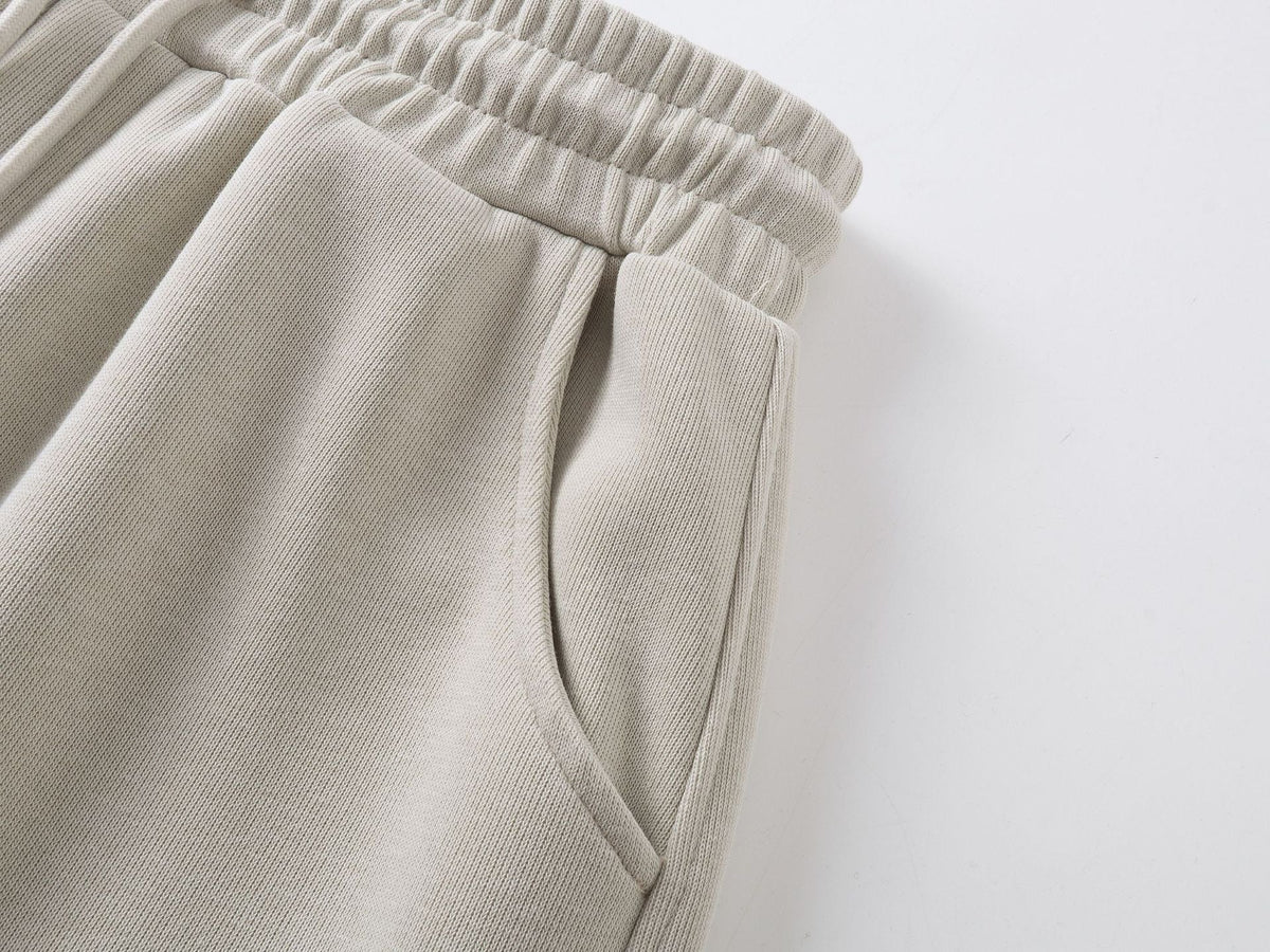 DAXUEN beige oversized abstract tribal graphic sweatpants
