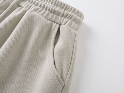 DAXUEN beige oversized abstract tribal graphic sweatpants