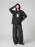 DAXUEN Acid wash long sleeve t-shirt with graphic design — model photo