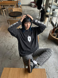 DAXUEN Acid wash long sleeve t-shirt with graphic design — model photo