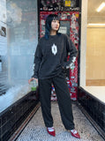 DAXUEN Acid wash long sleeve t-shirt with graphic design — model photo
