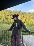DAXUEN Acid wash long sleeve t-shirt with graphic design — model photo