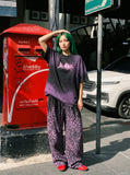 DAXUEN Oversized acid wash t-shirt with graphic design — model photo