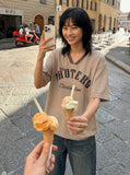 DAXUEN Loose-fitting short-sleeved V-neck T-shirt with graphic — model photo