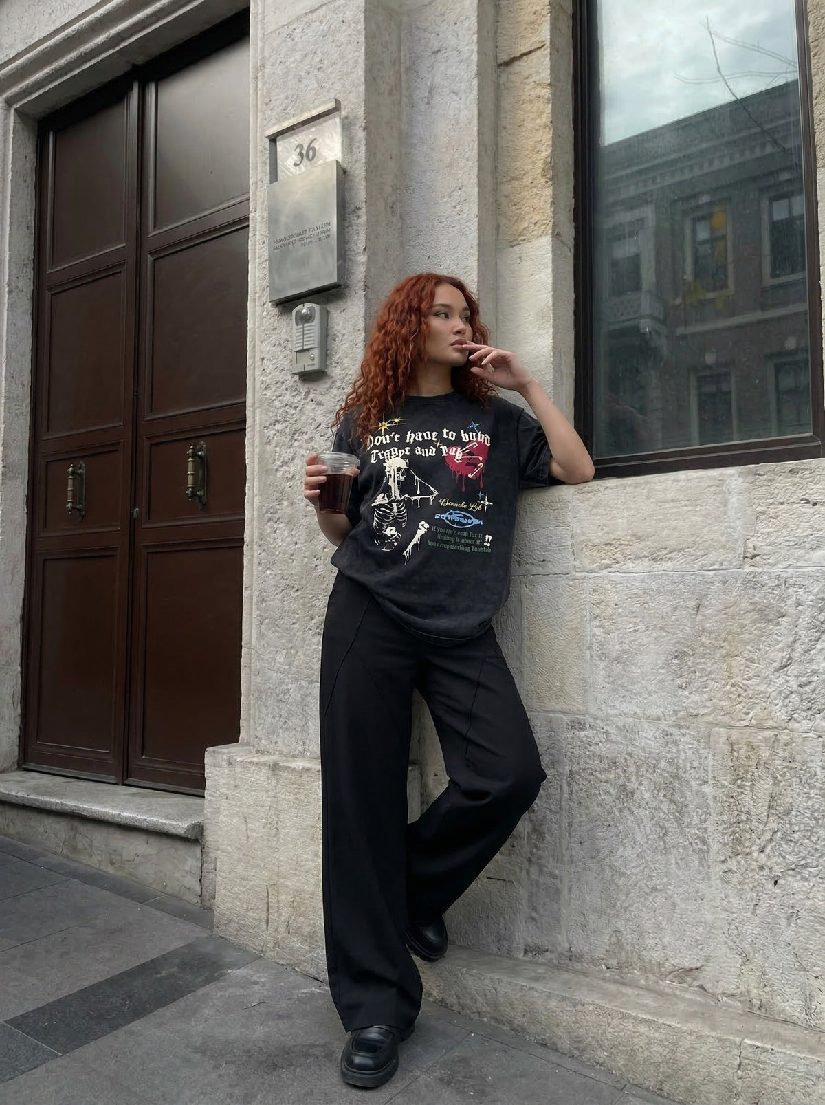 Grungy graphic t-shirt with skull and text — model photo