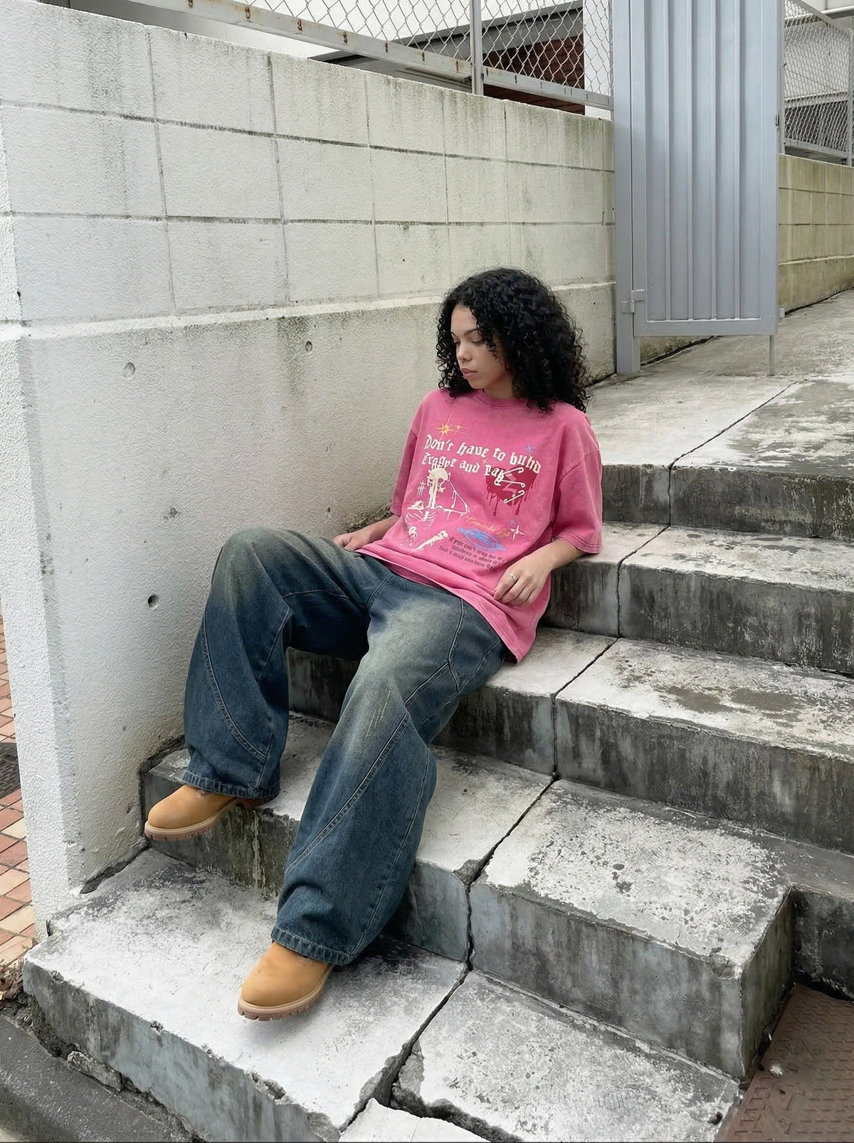 Grungy graphic t-shirt with skull and text — model photo