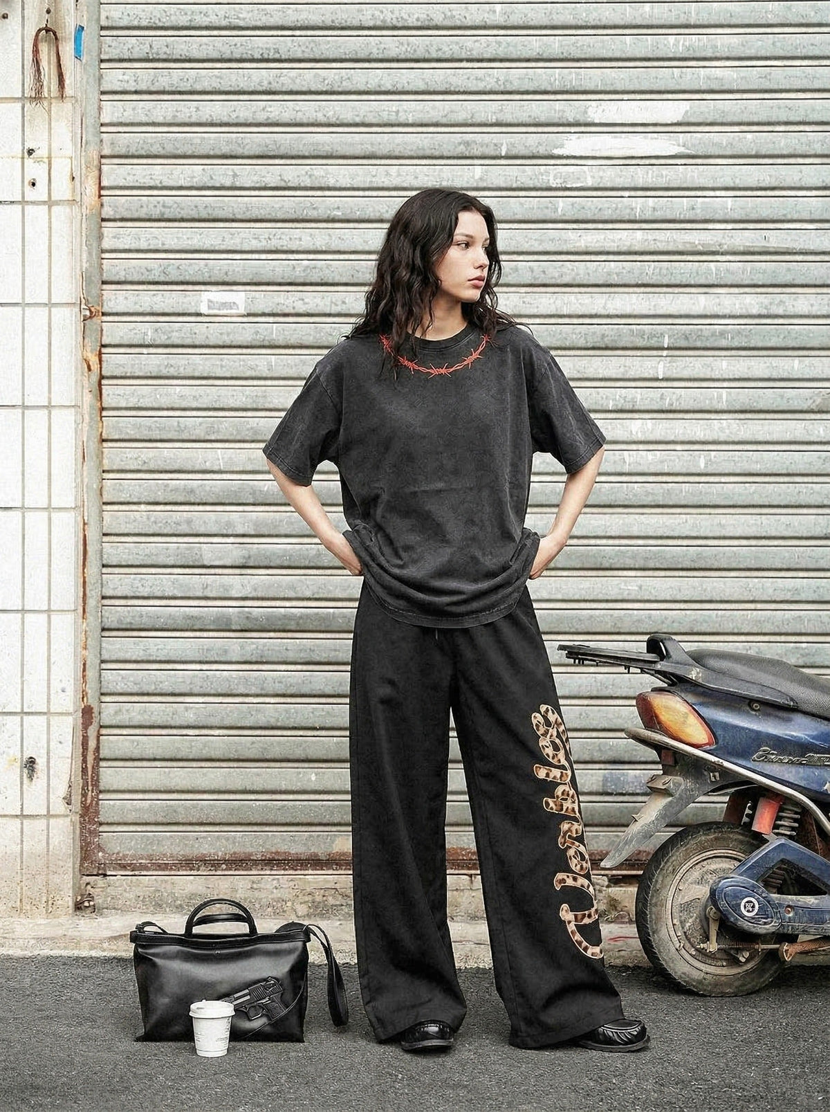 Washed black loose-fit graphic T-shirt — model photo