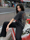 Washed black loose-fit graphic T-shirt — model photo