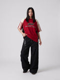 DAXUEN black angular crocodile-panel trousers — model photo