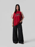 DAXUEN black angular crocodile-panel trousers — model photo