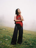 DAXUEN black angular crocodile-panel trousers — model photo