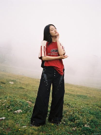 DAXUEN black angular crocodile-panel trousers — model photo