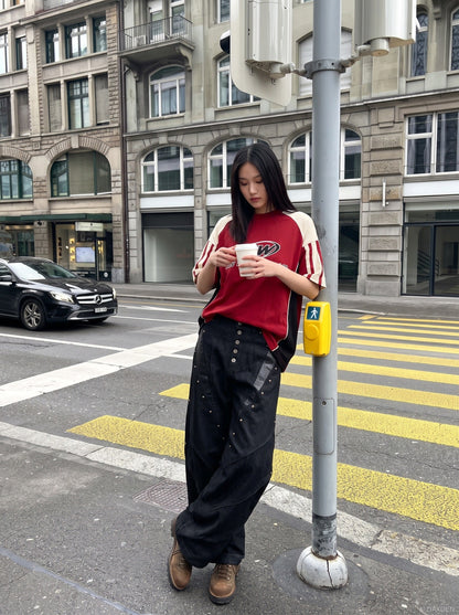 DAXUEN black angular crocodile-panel trousers — model photo