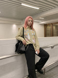 DAXUEN light yellow plaid button-up shirt with anime graphics — model photo