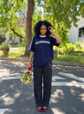 DAXUEN solid navy blue oversized arched text graphic t-shirt — model photo