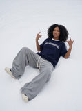 DAXUEN solid navy blue oversized arched text graphic t-shirt — model photo