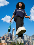 DAXUEN solid navy blue oversized arched text graphic t-shirt — model photo