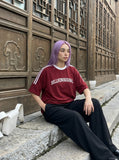 DAXUEN solid navy blue oversized arched text graphic t-shirt — model photo