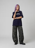 DAXUEN solid navy blue oversized arched text graphic t-shirt — model photo
