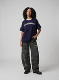 DAXUEN solid navy blue oversized arched text graphic t-shirt — model photo