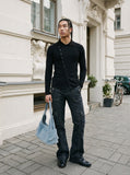 DAXUEN black asymmetric button-up long sleeve top — model photo