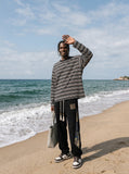DAXUEN black and white asymmetric stripe oversized long sleeve top — model photo