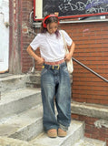 DAXUEN Asymmetrical button detail short-sleeved t-shirt — model photo