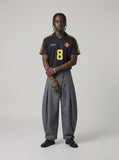 DAXUEN grey wide-leg trousers with asymmetrical button detail — model photo