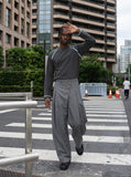 DAXUEN grey wide-leg trousers with asymmetrical button detail — model photo