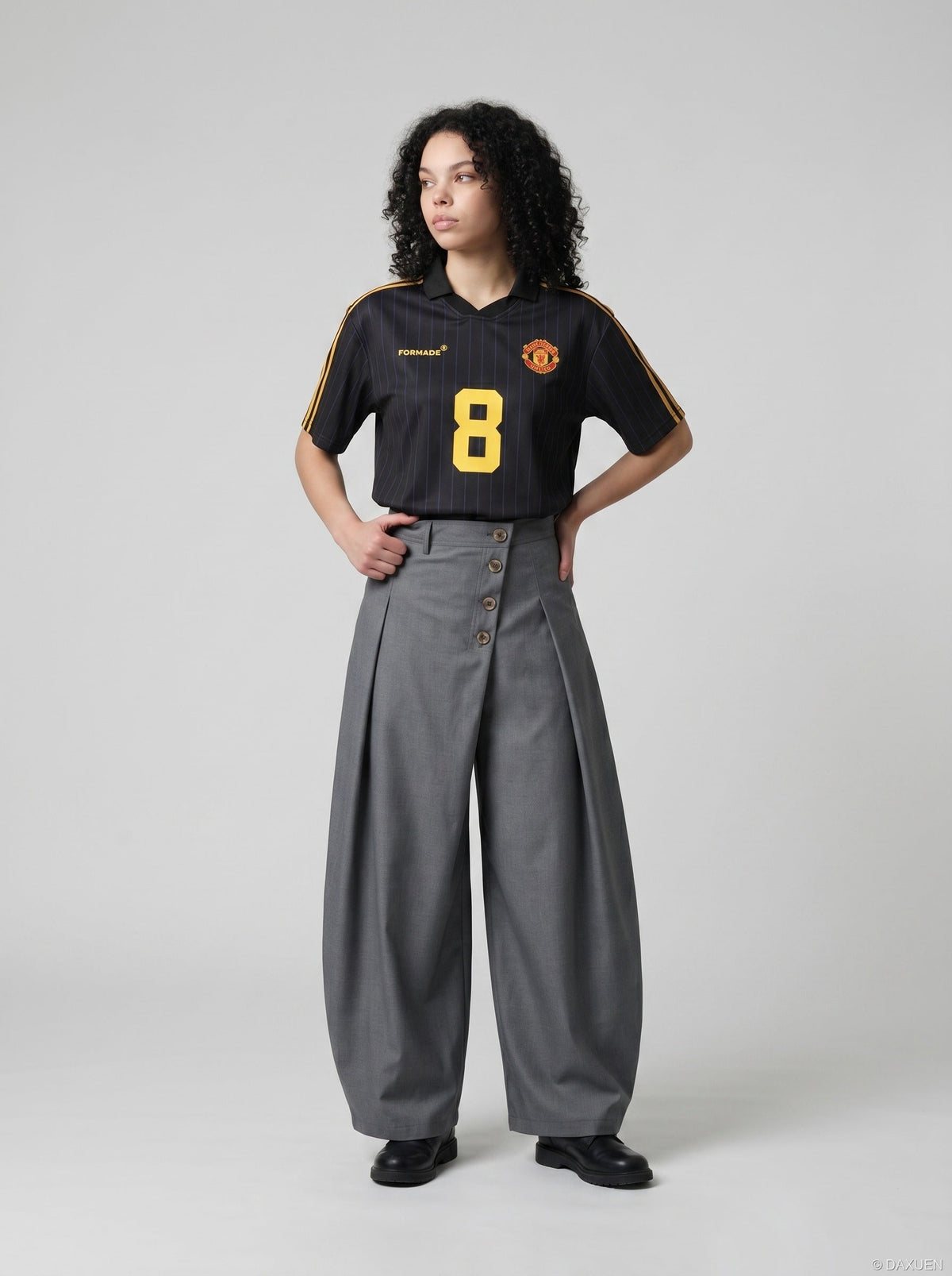DAXUEN grey wide-leg trousers with asymmetrical button detail — model photo