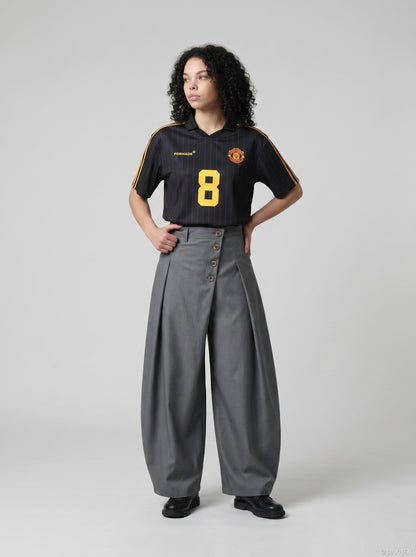 DAXUEN grey wide-leg trousers with asymmetrical button detail — model photo