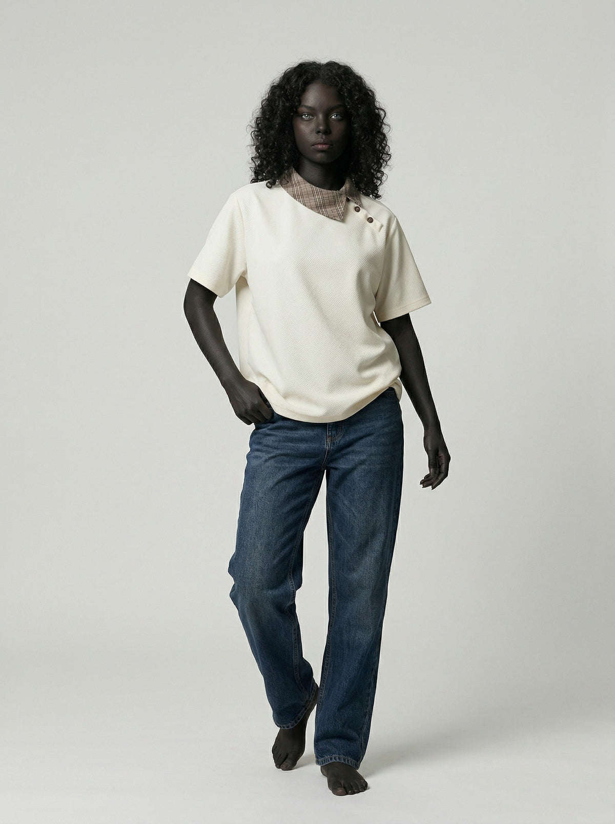 DAXUEN Asymmetrical collar short-sleeve top in cream and black — model photo
