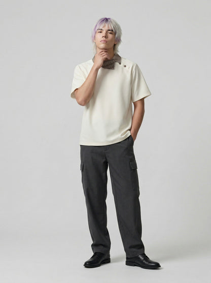 DAXUEN Asymmetrical collar short-sleeve top in cream and black — model photo