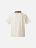 DAXUEN Asymmetrical collar short-sleeve top in cream and black