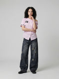 DAXUEN Women's asymmetrical off-shoulder shirt with stripes and graphic — model photo