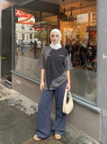 DAXUEN Asymmetrical panel t-shirt in charcoal grey and dark waffle knit — model photo